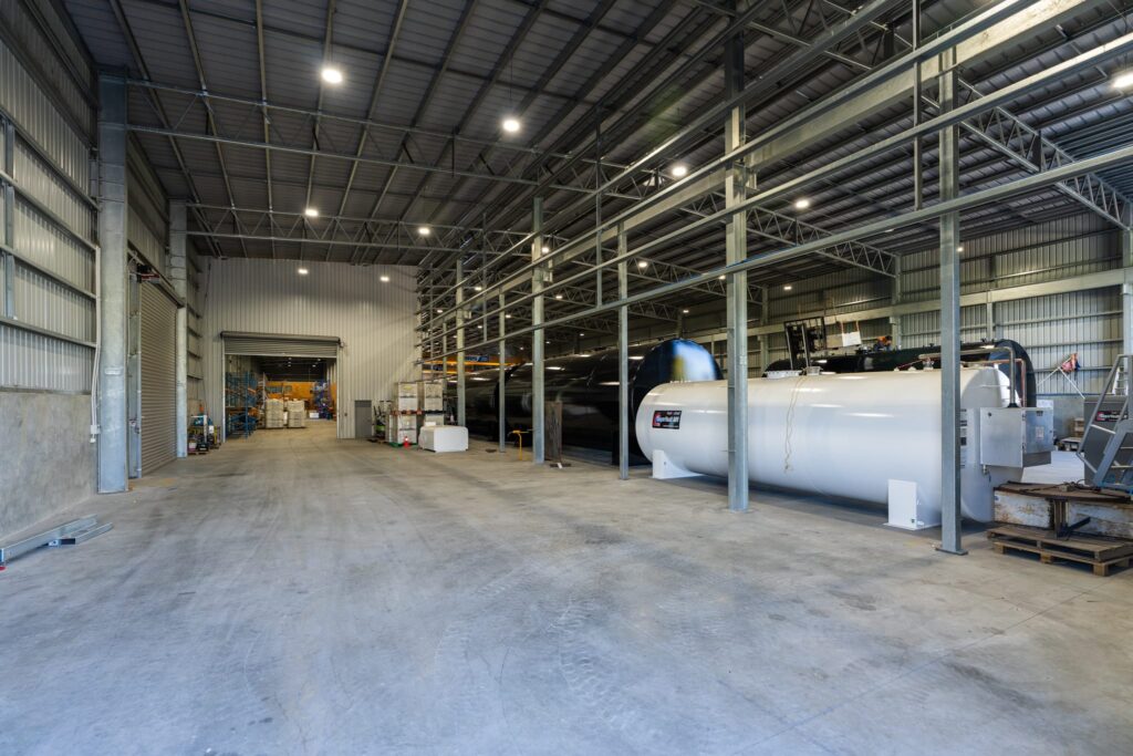 Maugers_Property_Innovation_Park_Drone_Shoot_13_3_26_Small_198 Expansive warehousing and logistics facility with clear-span access, storage areas and commercial building infrastructure at Innovation Park Christchurch. Ideal for commercial leasing, industrial business park users, property investment and business with property growth needs.