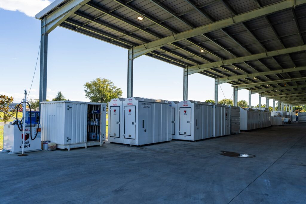 Maugers_Property_Innovation_Park_Drone_Shoot_13_3_26_Small_200 Covered industrial facility with fuel storage units and sheltered yard space at Innovation Park Templeton. A practical commercial property solution for agribusiness, industrial developments, warehousing support and property business operations.