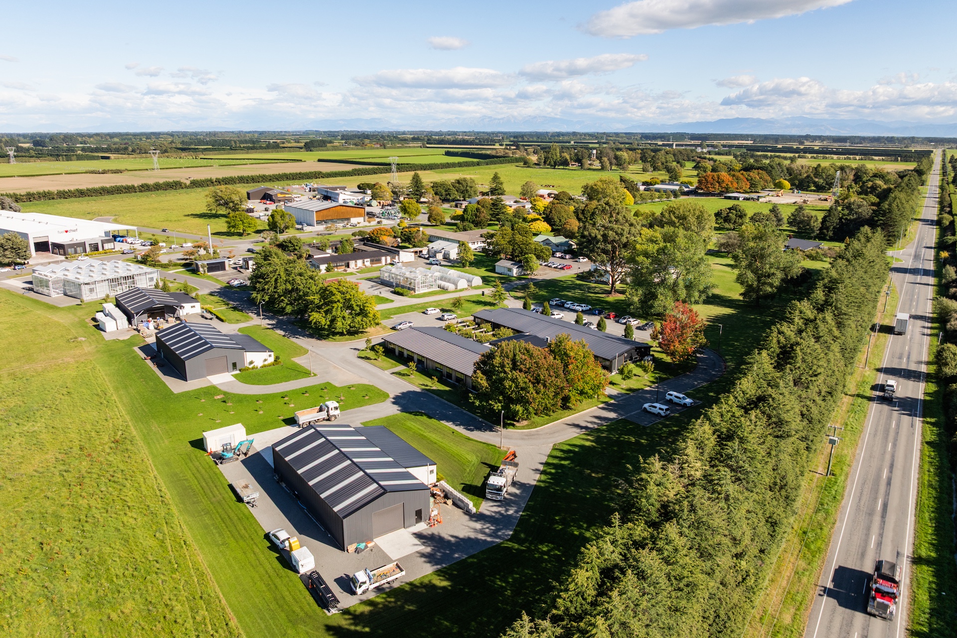 Elevated aerial view of Innovation Park Templeton showing commercial buildings, landscaped campus setting and main road frontage. Strategic commercial property location suited to office leasing, warehousing and business operations in Canterbury.