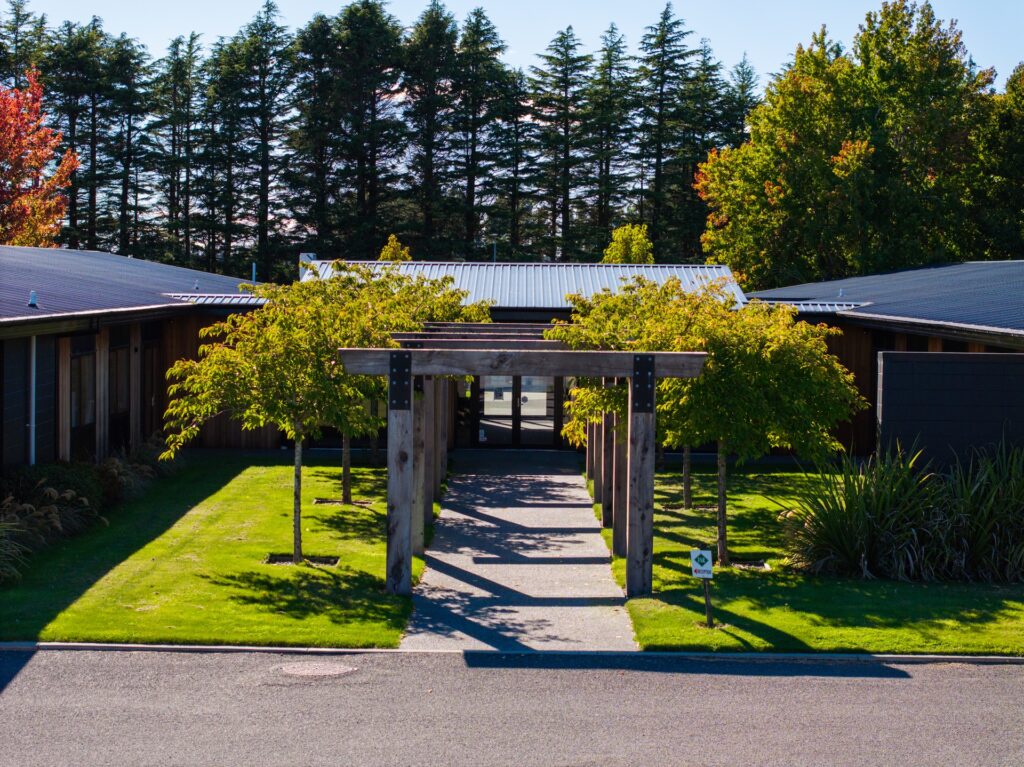 Maugers_Property_Innovation_Park_Drone_Shoot_13_3_26_Small_50 Landscaped entrance walkway framed by timber pergola leading into contemporary office space at Innovation Park Templeton. Attractive commercial premises suited to professional offices, business leasing and premium workplace environments.